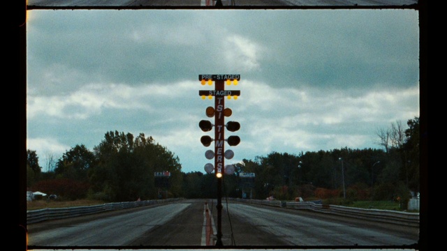 Video Reference: Cloud, Sky, Plant, Infrastructure, Road surface, Asphalt, Natural landscape, Traffic light, Tree, Thoroughfare