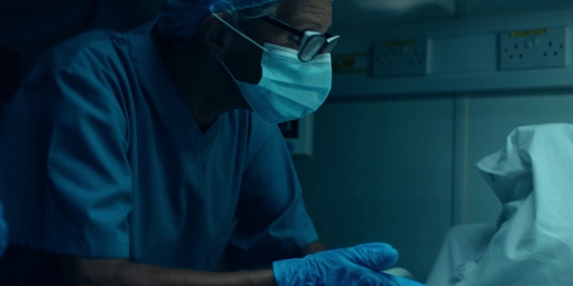 Video Reference: Health care provider, Scrubs, Medical equipment, Surgeon, Operating theater, Safety glove, Medical procedure, Health care, Medical glove, Medical assistant