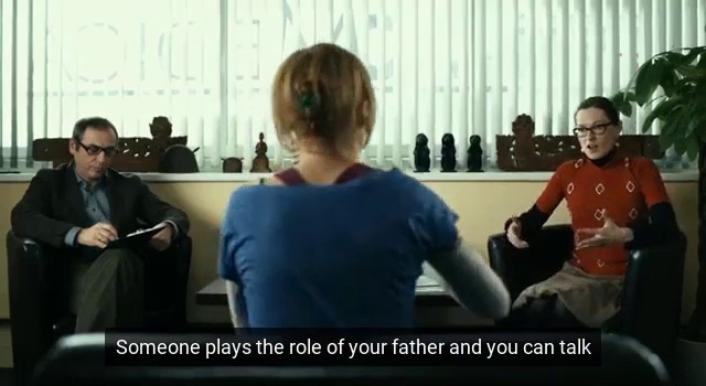 Video Reference: Gesture, Event, Conversation, Houseplant, T-shirt, Sitting, Curtain, Job, Room, Chair