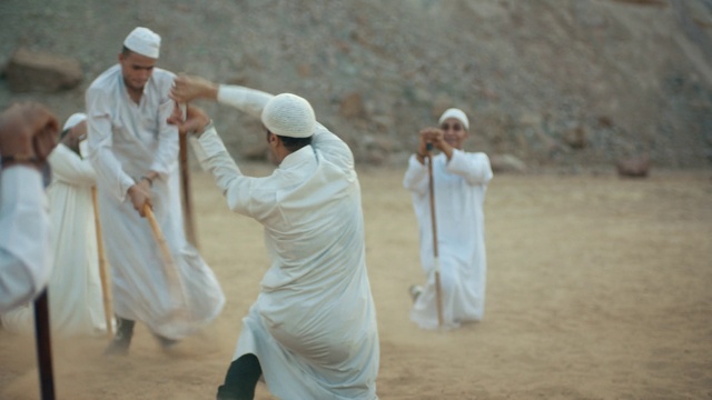 Video Reference: Gesture, Sleeve, Event, Landscape, Competition event, Recreation, Uniform, Tradition, Soil