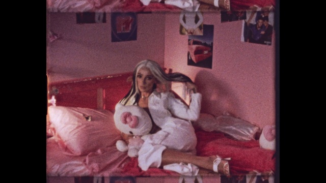 Video Reference: Picture frame, Purple, Flash photography, Pink, Dress, Magenta, Comfort, Event, Room, Couch