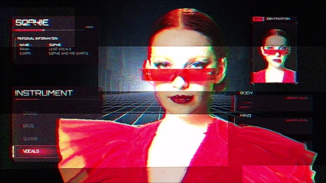 Video Reference: Art, Red, Font, Eyewear, Entertainment, Fashion design, Fictional character, Performing arts, Event, Magenta
