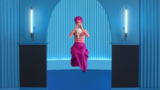 Video Reference: Blue, Purple, Flash photography, Entertainment, Pink, Magenta, Performing arts, Fashion design, Electric blue, Event