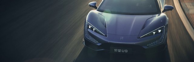 Video Reference: sports car, car, driving, road, motion blur, front view, aerial view, automotive, fast, sleek, headlights, night, travel, luxury car
