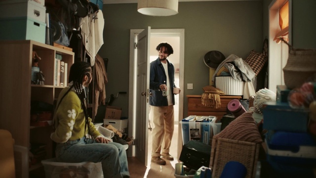 Video Reference: Picture frame, Lighting, Lamp, Chair, Wood, Event, Hat, T-shirt, Luggage and bags, Conversation