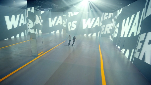 Video Reference: Asphalt, Road surface, Flooring, Font, Art, Glass, Space, Ceiling, Road, Event