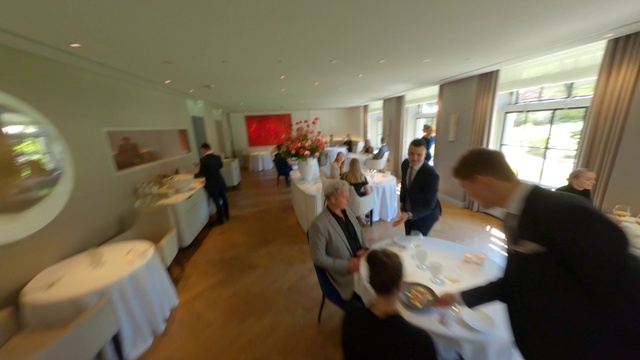 Video Reference: Table, Furniture, Chair, Suit, Event, Tablecloth, Function hall, Ceiling, Tableware, Flooring