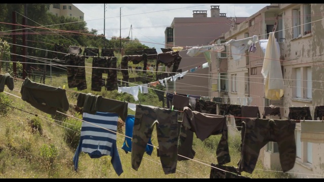 Video Reference: Building, Plant, Urban design, Flag, Sky, City, Facade, Rectangle, Slope, Pole