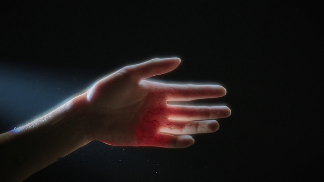 Video Reference: Human body, Gesture, Thumb, Automotive lighting, Nail, Electric blue, Wrist, Darkness, Foot, Event