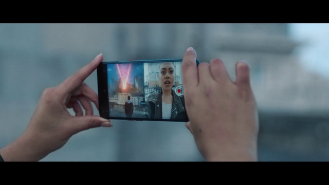 Video Reference: Gesture, Finger, Thumb, Sky, Gadget, Font, Display device, Electronic device, Nail, Wrist