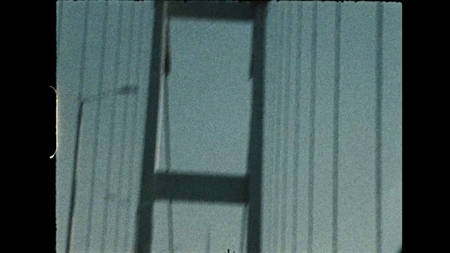 Video Reference: Wood, Rectangle, Automotive tire, Grey, Mesh, Automotive exterior, Font, Tints and shades, Facade, Pattern