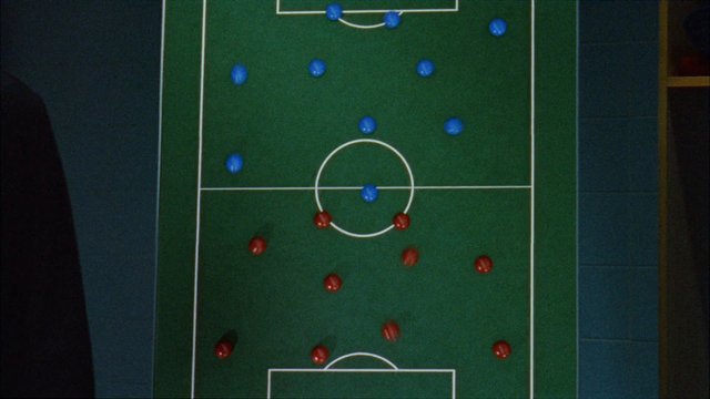 Video Reference: soccer, football, tactics, strategy, formation, playboard, sports, top-down, diagram, teamwork, blue markers, red markers, field, match analysis