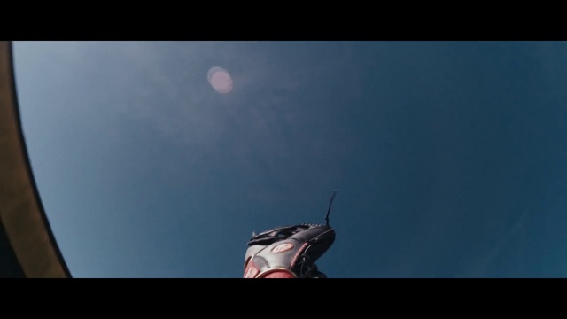 Video Reference: Sky, Gesture, Tints and shades, Wing, Flash photography, Human leg, Foot, Rectangle, Electric blue, Elbow