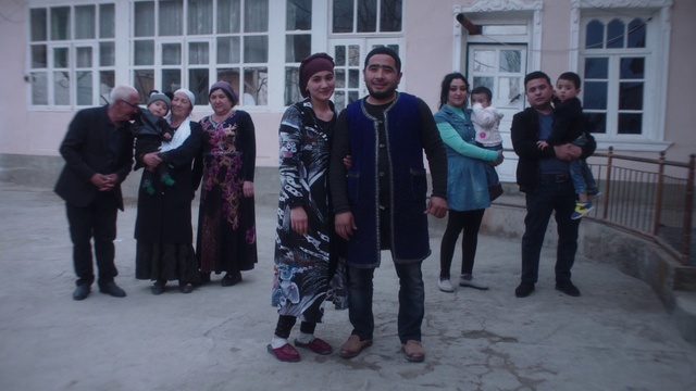 Video Reference: Footwear, Smile, Window, Fashion, Standing, Street fashion, Event, Fun, Scarf, Formal wear