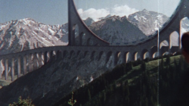 Video Reference: Sky, Mountain, Cloud, Snow, Fence, Plant, Landscape, Mountain range, Bridge, Arch bridge