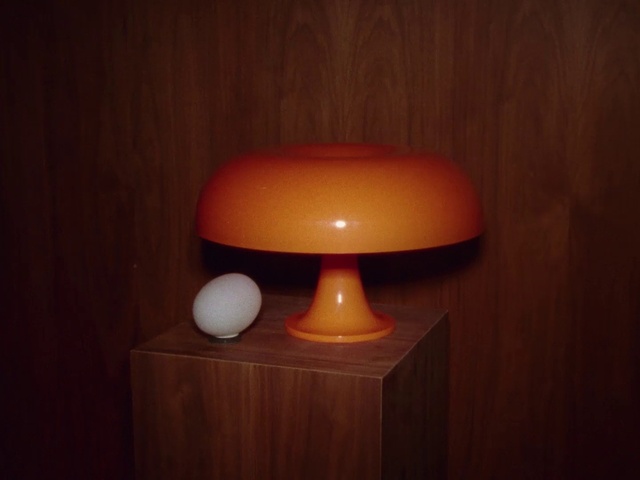 Video Reference: Table, Lamp, Wood, Tints and shades, Hardwood, Facial hair, Flooring, Peach, Plywood, Shelving