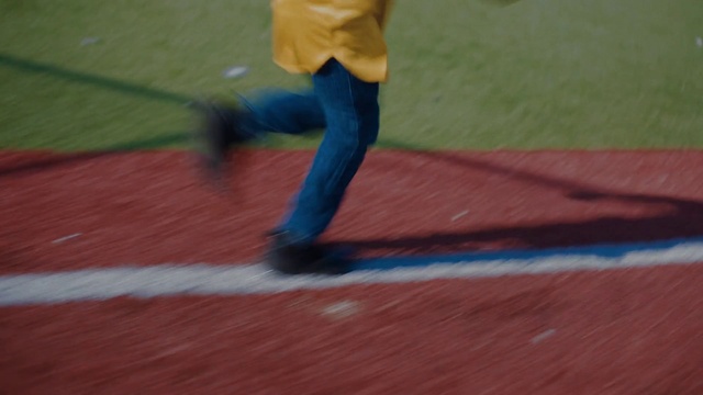 Video Reference: Jeans, Leg, Flooring, Wood, Asphalt, Player, Sneakers, Ball game, Grass, Sportswear