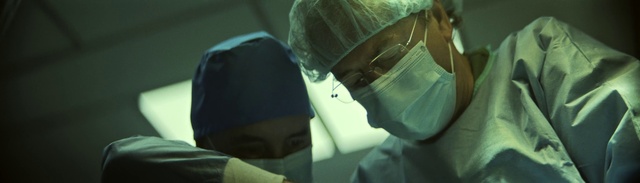 Video Reference: Surgeon, Medical, Eyewear, Headgear, Health care provider, Health care, Hat, Operating theater, Service, Personal protective equipment