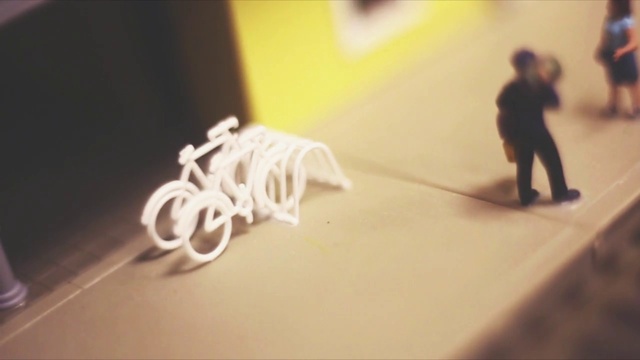 Video Reference: Wood, Art, Flooring, Toy, Font, Paper, Visual arts, Shadow, Fashion accessory, Bicycle handlebar
