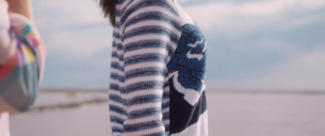 Video Reference: Cloud, Water, Outerwear, Shoulder, Leg, Human body, Neck, Textile, Sleeve, Grey