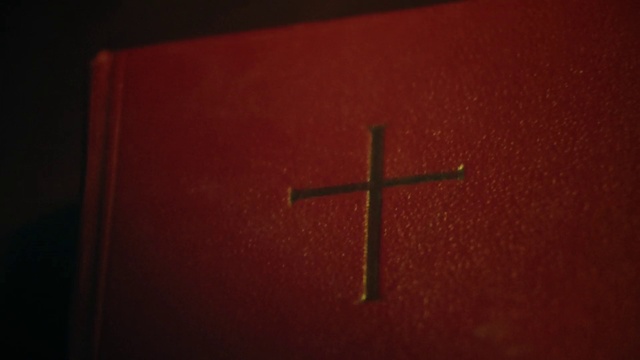 Video Reference: Brown, Cross, Orange, Window, Religious item, Wood, Font, Tints and shades, Symbol, Crucifix