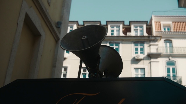 Video Reference: Sky, Building, Window, Art, Gas, House, Audio equipment, City, Telecommunications engineering, Facade