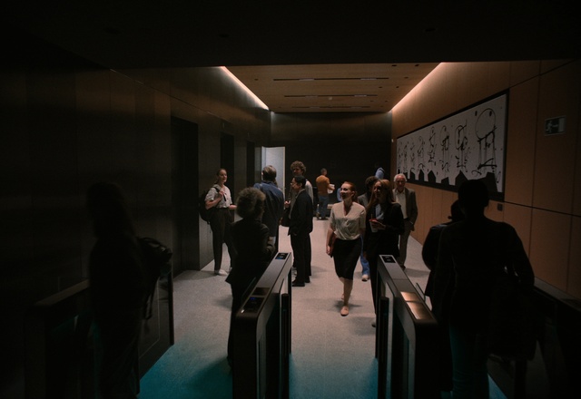 Video Reference: Chair, Entertainment, Automotive design, Fashion design, Event, Suit, Formal wear, Job, Visual arts, Darkness