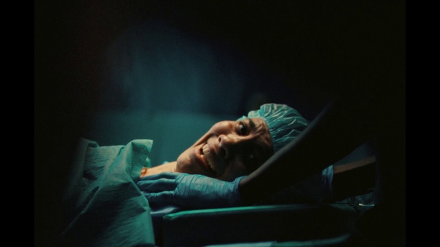 Video Reference: Couch, Flash photography, Comfort, Performing arts, Tints and shades, Entertainment, Event, Electric blue, Acting, Darkness