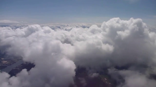 Video Reference: Cloud, Sky, Cumulus, Landscape, Wing, Meteorological phenomenon, Mountain range, Horizon, Aerial photography