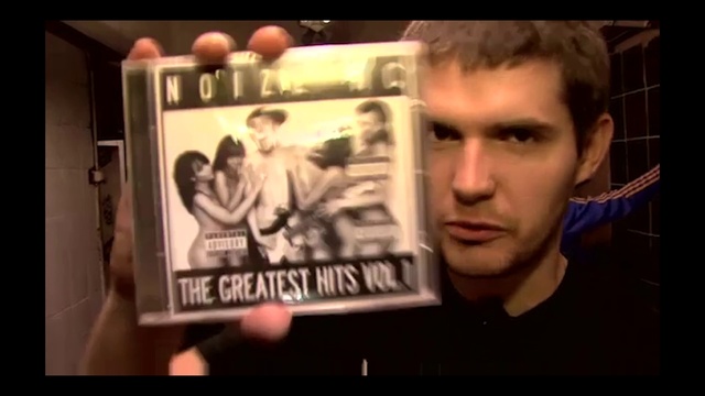 Video Reference: Muscle, Font, Movie, T-shirt, Flash photography, Display device, Beard, Event, Photo caption, Room