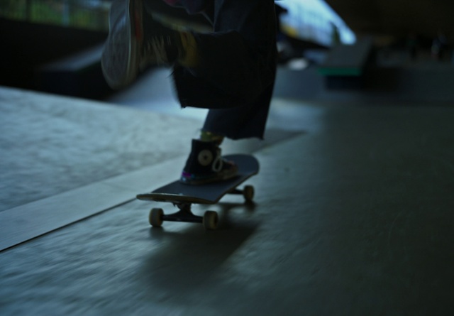 Video Reference: Skateboard deck, Sports equipment, Skateboard, Wheel, Asphalt, Skateboard truck, Kickflip, Rolling, Skateboarder, Skateboarding