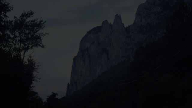 Video Reference: Sky, Cloud, Tree, Grey, Mountain, Atmospheric phenomenon, Terrain, Landscape, Natural landscape, Bedrock