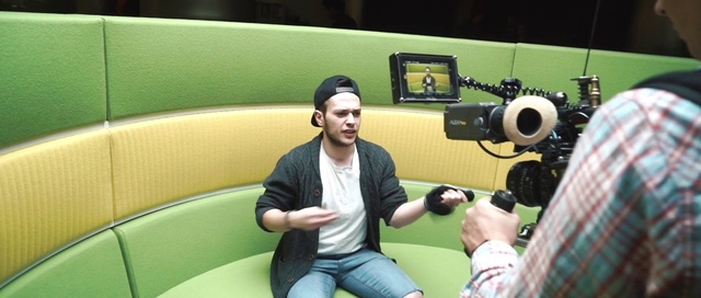 Video Reference: Jeans, Videographer, Yellow, Television crew, Camera, Video camera, Cinematographer, Comfort, Cameras & optics, T-shirt