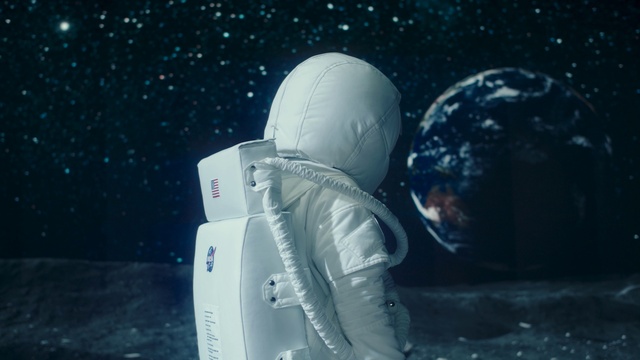 Video Reference: World, Sky, Astronaut, Astronomical object, Science, Space, Electric blue, Personal protective equipment, Automotive lighting, Event