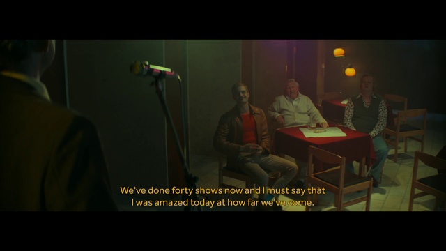 Video Reference: Microphone, Music, Musician, Font, Chair, Table, Entertainment, Event, Darkness, Conversation