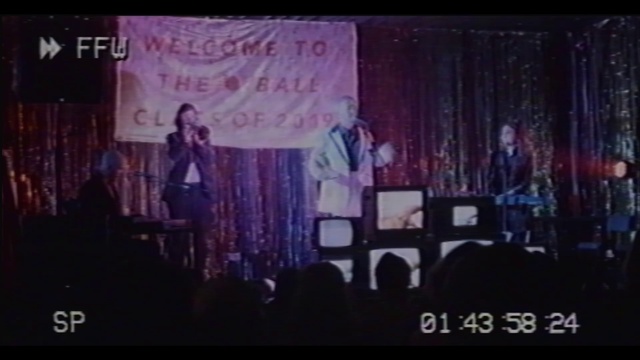 Video Reference: Purple, Entertainment, Performing arts, Display device, Magenta, Font, Event, Music venue, Music, Projector accessory