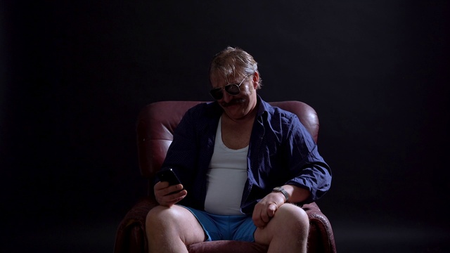 Video Reference: Glasses, Furniture, Comfort, Flash photography, Neck, Knee, Thigh, Entertainment, Eyewear, Performing arts