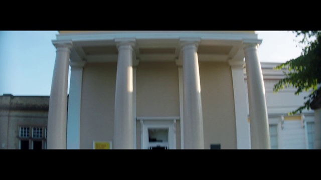 Video Reference: Sky, Building, Shade, Fixture, Facade, Rectangle, Tints and shades, Column, Tree, Symmetry