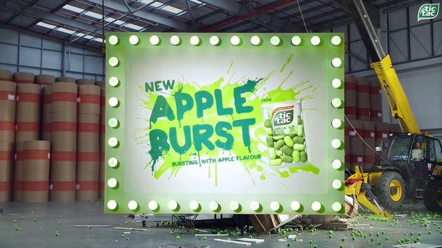 Video Reference: Tire, Wheel, Green, Yellow, Font, Entertainment, Display device, Stage equipment, Stage, Advertising