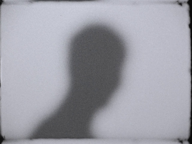 Video Reference: Eyelash, Gesture, Grey, Style, Black-and-white, Tints and shades, Font, Rectangle, Elbow, Darkness