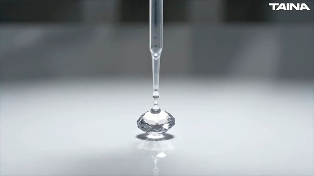 Video Reference: dropper, pipette, crystal, gemstone, clear liquid, macro, close-up, laboratory, minimal, reflection, white surface, gray background, still life, watermark