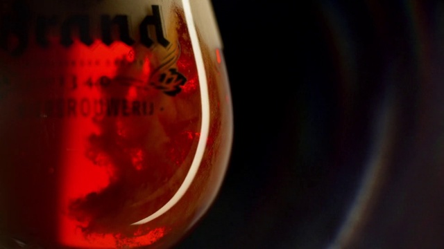 Video Reference: Liquid, Automotive lighting, Amber, Fluid, Drink, Circle, Ingredient, Glass, Tints and shades, Liqueur