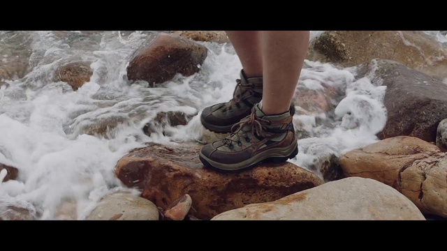 Video Reference: Footwear, Water, Shoe, Shorts, Leg, Body of water, People in nature, Sneakers, Outdoor shoe, Thigh