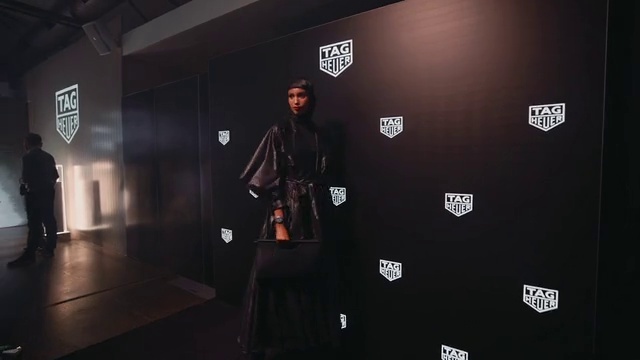 Video Reference: Flash photography, Sleeve, Automotive design, Font, Hat, Flooring, Fashion design, Event, Eyewear, Logo