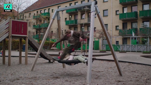 Video Reference: Building, Window, Green, Plant, Tree, Leisure, Playground, Outdoor play equipment, Swing, Recreation
