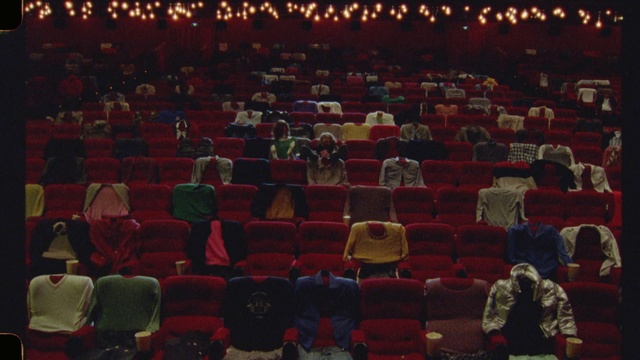 Video Reference: Outerwear, Human, Chair, Lighting, Crowd, Entertainment, Red, Movie theater, Youth, Event