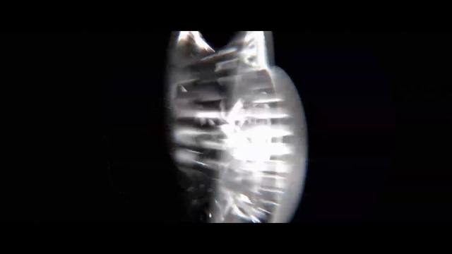 Video Reference: Automotive lighting, Font, Gas, Circle, Art, Transparent material, Darkness, Electric blue, Event, Symmetry