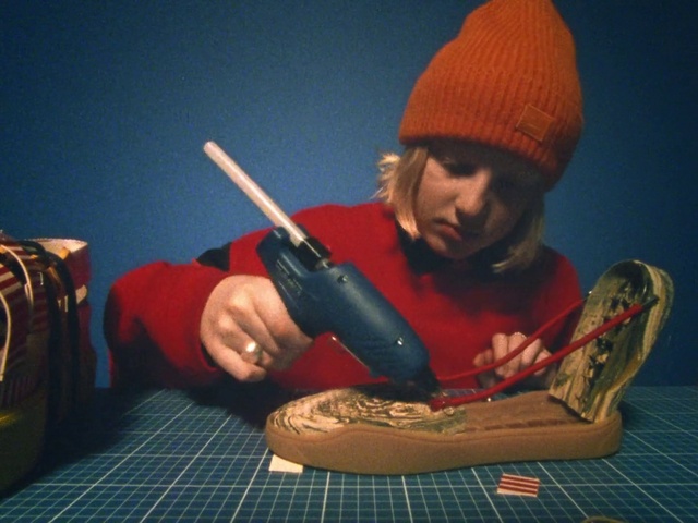 Video Reference: Musical instrument, String instrument, Musician, Elbow, Backpack, Cap, Luggage and bags, Carmine, Music, Knit cap