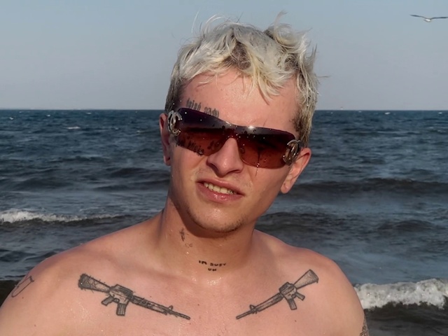 Video Reference: Hair, Face, Glasses, Water, Sky, Head, Chin, Hairstyle, Vision care, Sunglasses