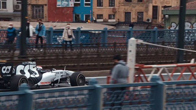 Video Reference: Vehicle, Tire, Wheel, Car, Automotive tire, Building, Window, Automotive design, Fence, Racing